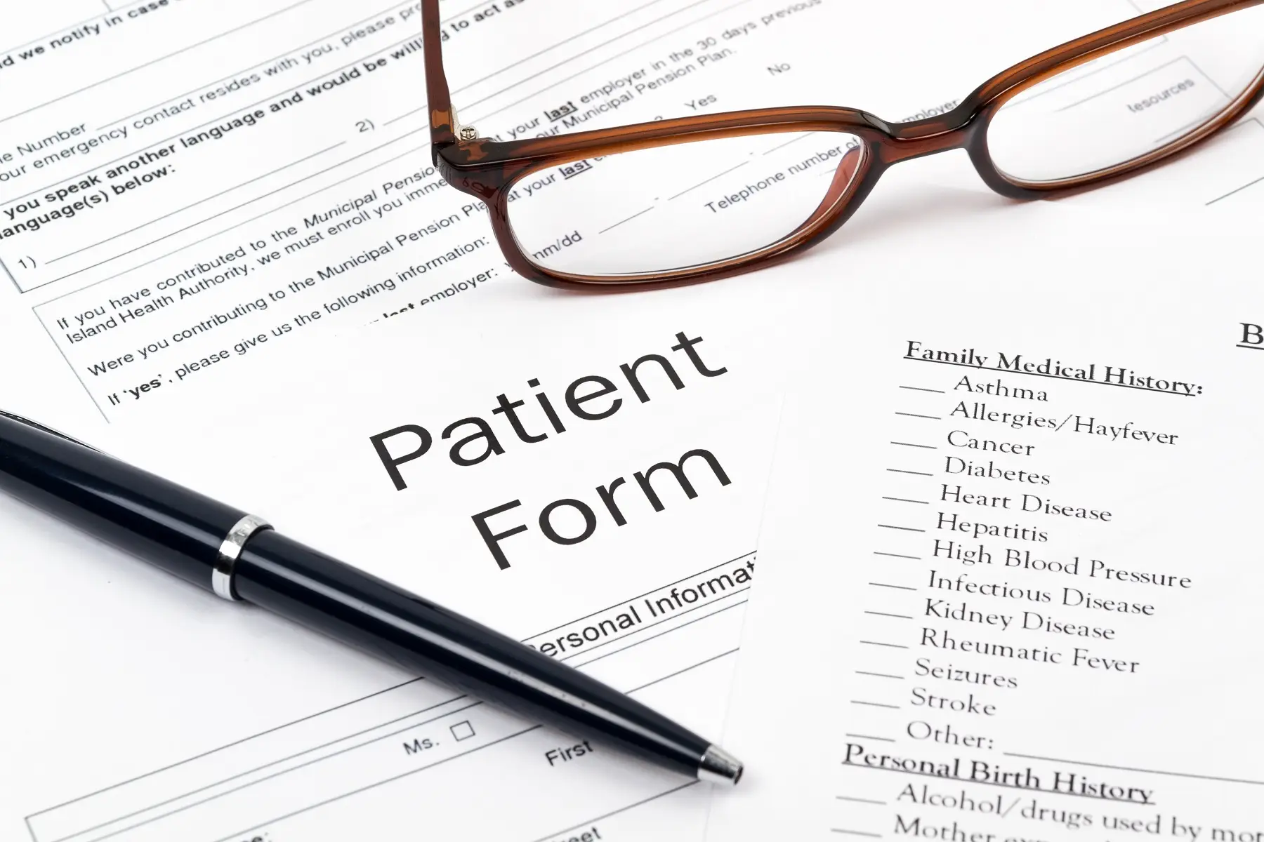 Patient form with glasses and pen